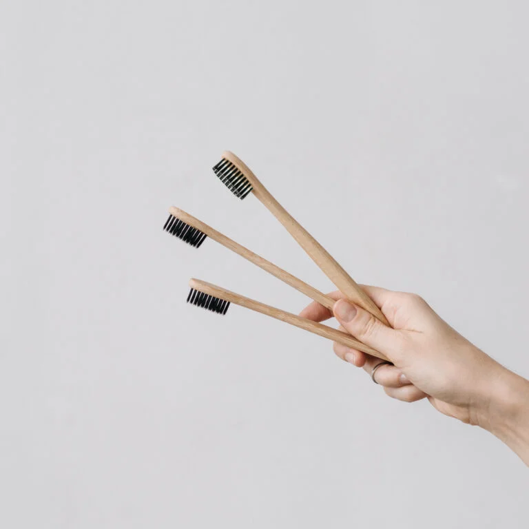 bambuhay-hand-offering-toothbrush | Bambuhay | Bambuhay